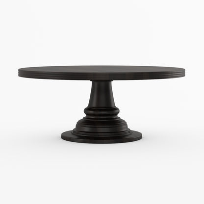 A round black pedestal dining table with a fluted top and a tiered turned base.
