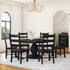 Dining room with a black round table and chairs